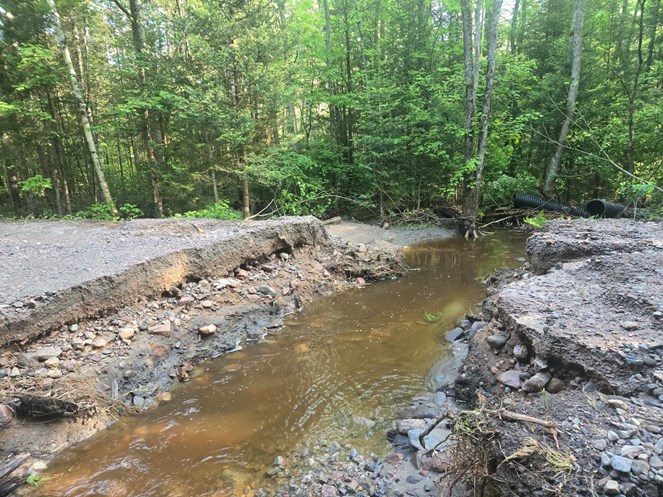 Culvert washed out on a gravel road