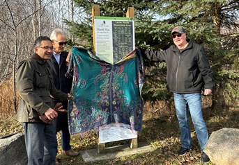 Unveiling a sign at Laurier Woods to thank donors for the new boardwalk, Fred Pinto, Mayor Peter Chirico, NBMCA Chair Dave Britton